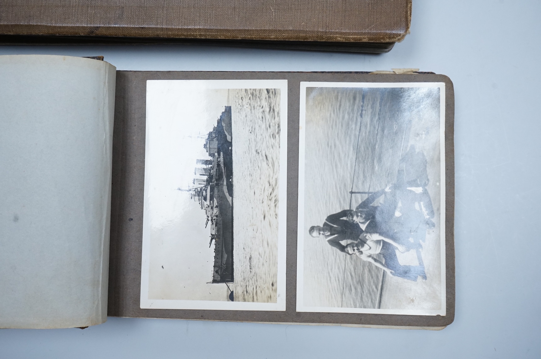 Two WWII naval photo albums, containing an archive of 1940s photographs of the Russian convoy in the Barents Sea, a ship’s concert at Scarpa Flow, a variety of Royal Naval vessels and some aircraft, images aboard HMS Peg